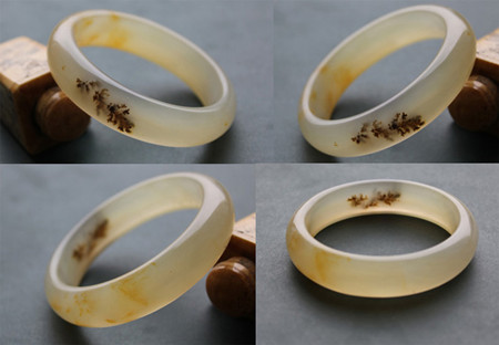 “黄龙也疯狂” 黄龙玉水草花精品手镯受追捧(图)_环球收藏网